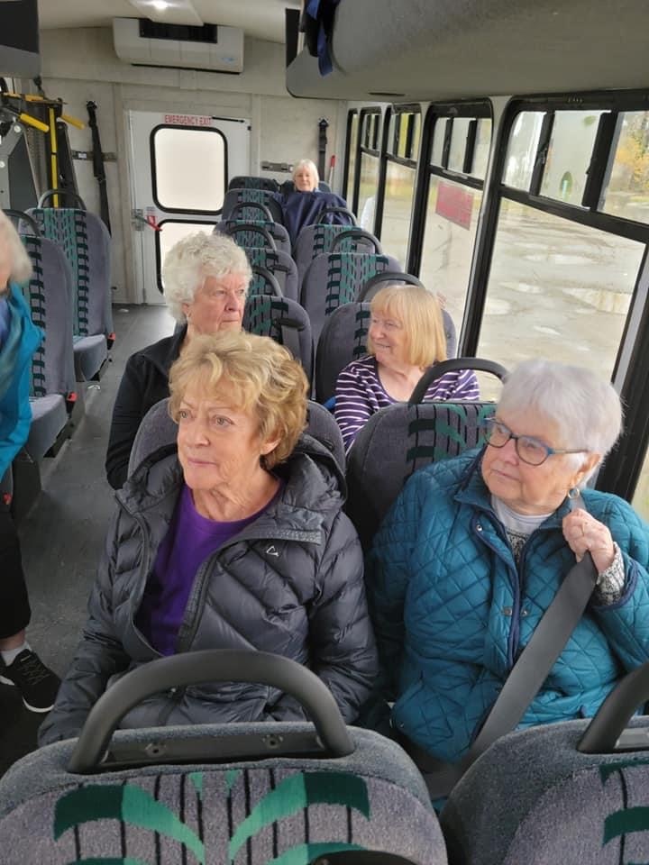 Members boarding the Kimta bus for a day trip.